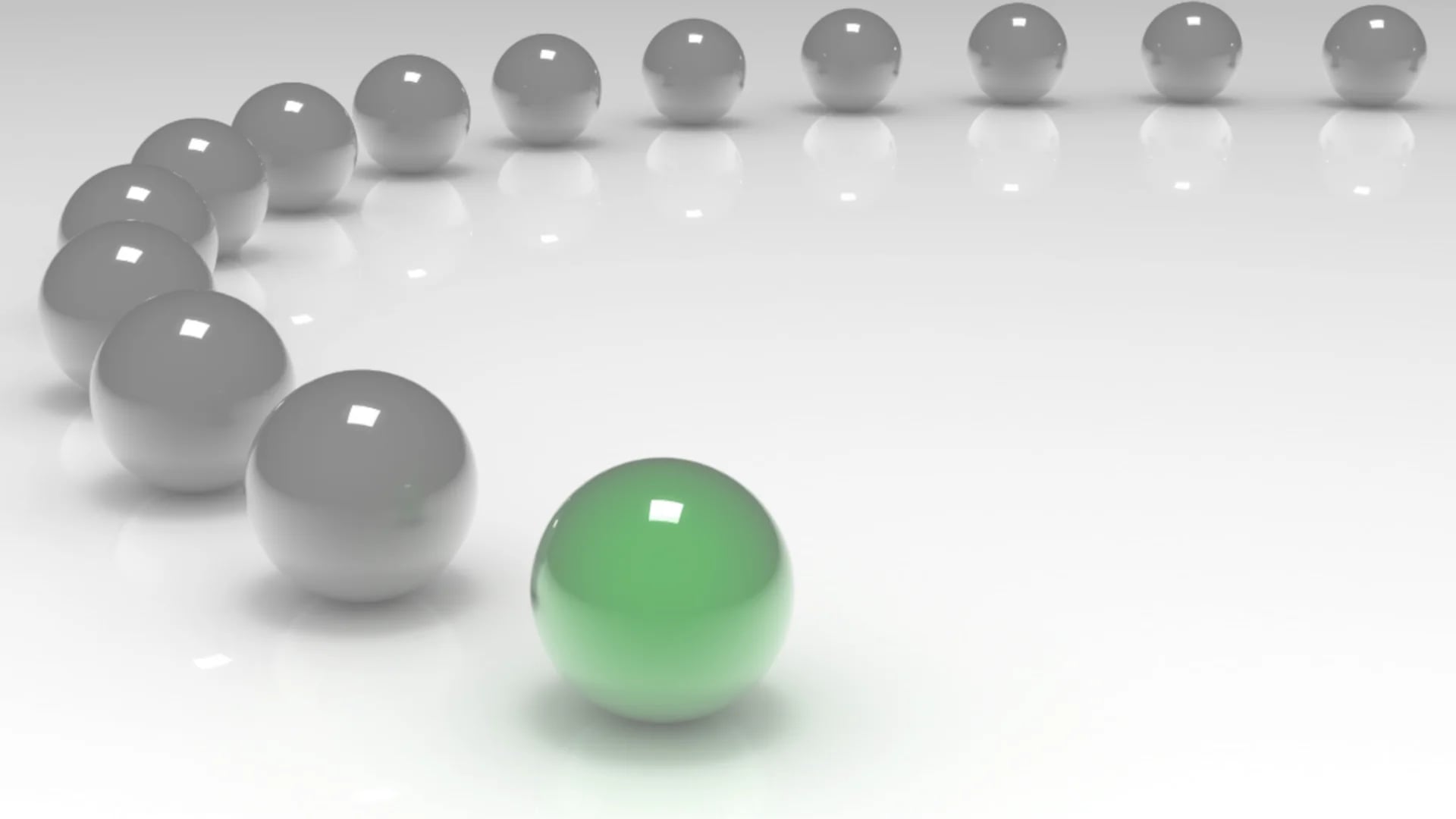 Un gruppo di sfere disposte lungo una traiettoria curvilinea in cui quella di testa ha una luminescenza verde mentre le restanti hanno una luminescenza grigia.